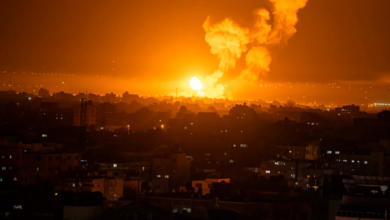 Fire and smoke rise following an Israeli airstrike in the central Gaza Strip on Friday.Fatima Shbair / AP