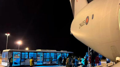 UK nationals disembarking from the first RAF flight from Sudan to Larnaca airport in Cyprus