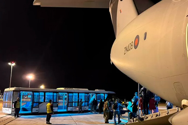 UK nationals disembarking from the first RAF flight from Sudan to Larnaca airport in Cyprus