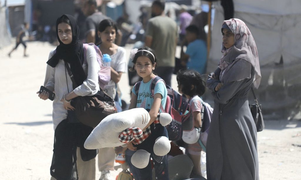 Palestinians living in al-Mawasi, a district in the west of Gaza City, relocate after an Israeli evacuation warning. Photograph: Habboub Ramez/Abaca/Rex/Shutterstock