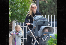 Amber Heard All Smiles as Johnny Depp Films Hollywood Return