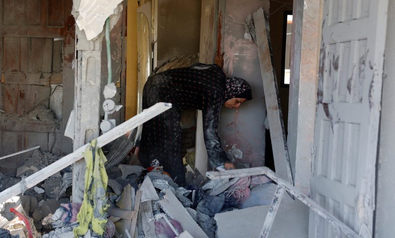 Palestinians in Gaza search through homes destroyed by Israeli strikes