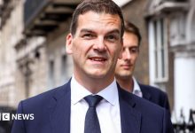 Former top official Robbins takes legal action over sacking