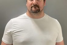 School employee accused of secretly filming 12 girls in changing room faces new charges