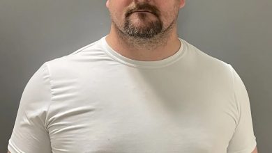 School employee accused of secretly filming 12 girls in changing room faces new charges