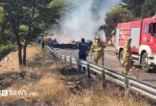 Two crew killed after firefighting helicopters collide in Greece, as British pilot survives