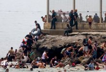 Hundreds of migrants swim from Morocco to Spanish enclave of Ceuta