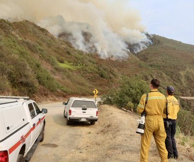 Quickly spreading wildfires trigger evacuations along Calif. coast
