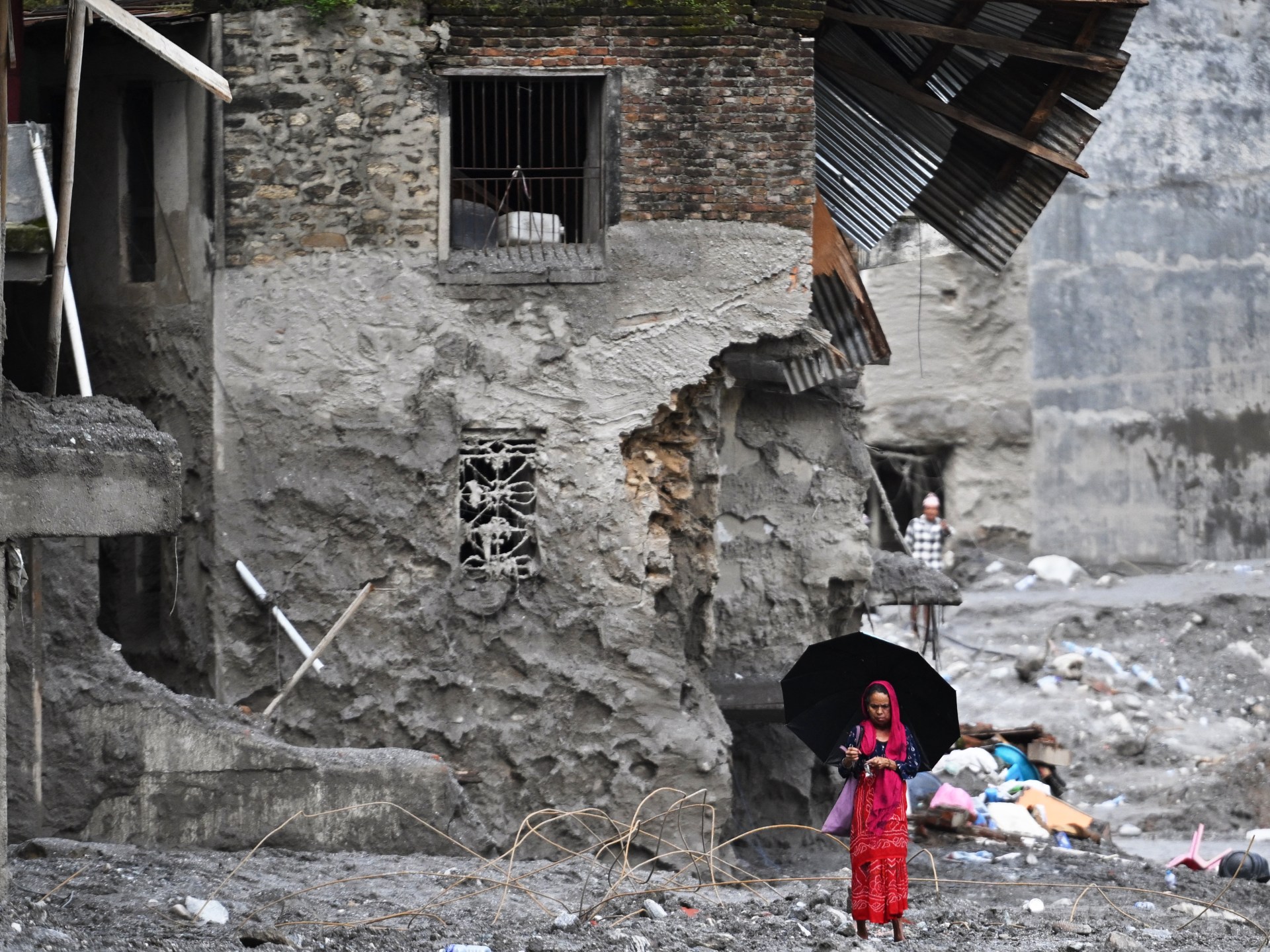 Death toll from devastating floods in China and Nepal surpasses 1,000