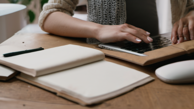 AI-generated image: A person's hands are visible, operating a silver laptop.