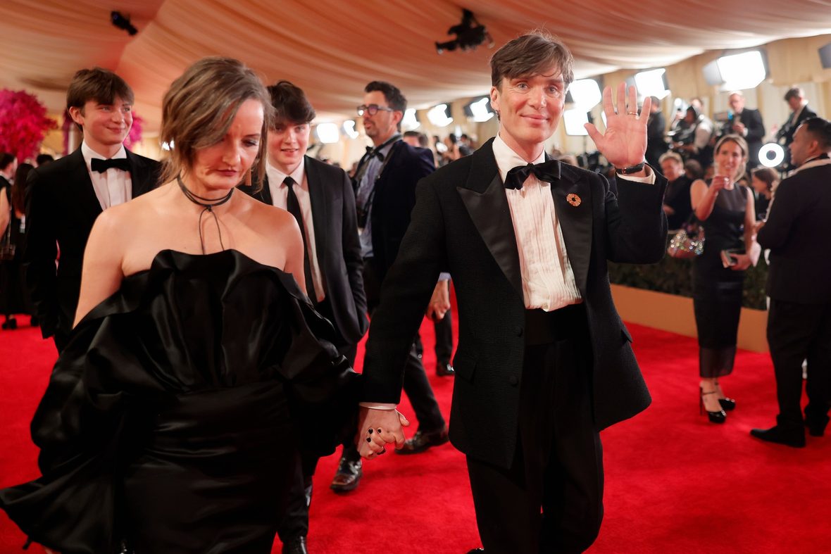 Cillian Murphy and Yvonne McGuinnes walk the red carpet at the 2024 Oscars with their sons