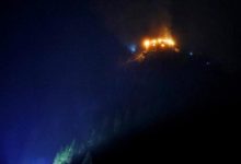 Image caption, The Eagle's Nest was still on fire early on Saturday