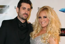 In a 2012 red carpet photo, a smiling Bridget Marquardt in a sparkling silver dress poses next to Nicholas Carpenter in a black suit…