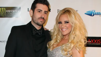 In a 2012 red carpet photo, a smiling Bridget Marquardt in a sparkling silver dress poses next to Nicholas Carpenter in a black suit…