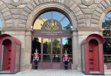 Presidential Palace in Sofia, entrance with two guard boxes on each side, two guards in ceremonial uniform in front of the door