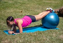 Girl exercising doing plank on stability ball.jpg