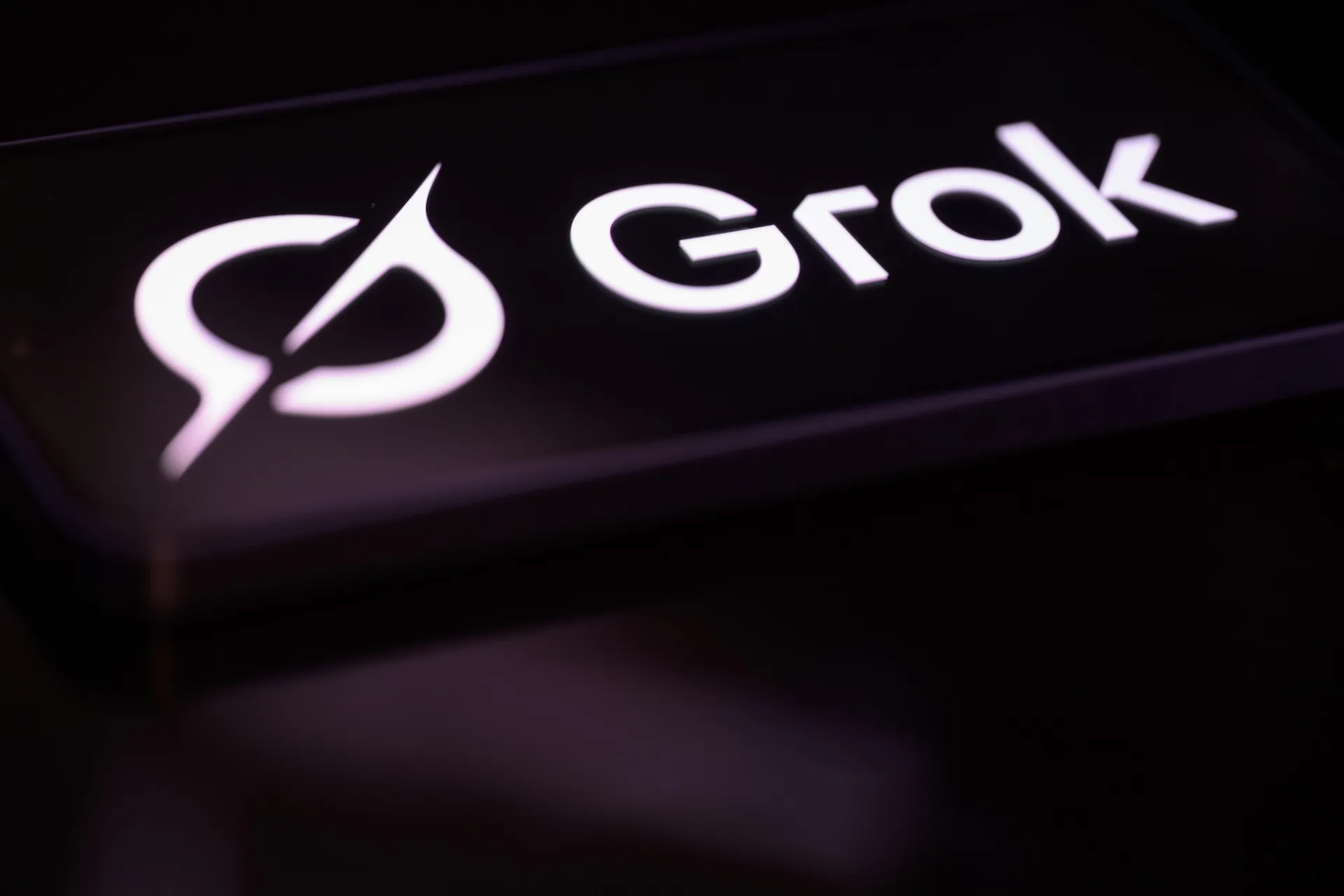 The Grok logo is displayed on a mobile phone screen in this photo illustration in Brussels, Belgium, on February 22, 2026.