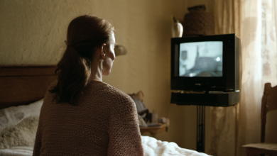 AI-generated image: A woman with brown hair pulled back into a ponytail is sitting on a bed.