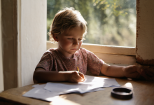 AI-generated image: A young child with blonde hair is sitting at a wooden table, writing with a yellow pencil on a white sheet of paper.