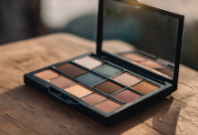 AI-generated image: A makeup eyeshadow palette is open on a wooden surface.
