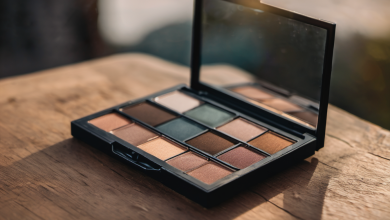 AI-generated image: A makeup eyeshadow palette is open on a wooden surface.