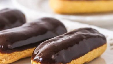 Chocolate eclairs on a white plate