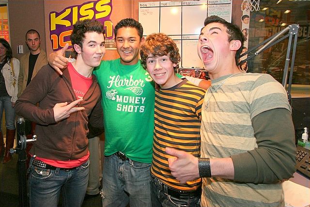 The Jonas Brothers with fan.jpg