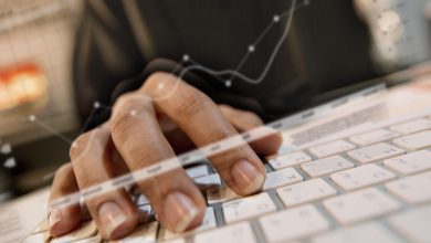 Person typing at keyboard with screen overlays.jpg