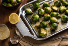 AI-generated image: A close-up food photograph shows a tray of roasted Brussels sprouts with rice, arranged on a dark wooden table.