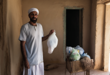 AI-generated image: A man is standing indoors, holding a white bag in his right hand.