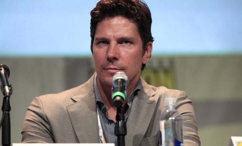Michael Trucco working out at home in a garage with fitness equipment