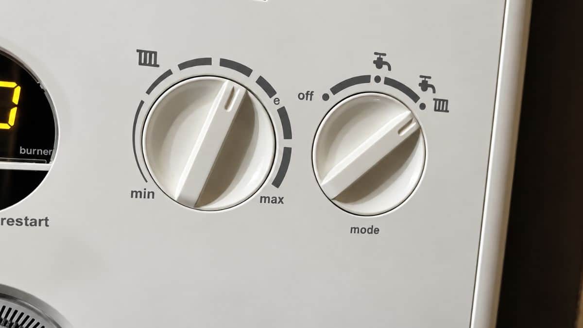 The central heating temperature dial (left) and operating mode selector (right) on our Ideal boiler. Photo: Skint Dad.