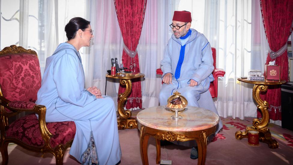 Image caption, El Mansouri (left) was named by King Mohammed VI (right) as the country's first female prime minister