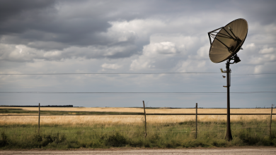 AI-generated image: A satellite dish is mounted on a pole in the foreground.