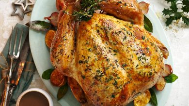 Next level roast turkey served on an oval dish with gravy alongside