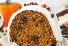 A slice of pumpkin chocolate chip bundt cake on a white plate