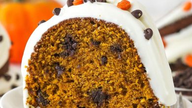 A slice of pumpkin chocolate chip bundt cake on a white plate