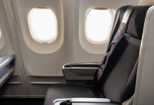 AI-generated image: The image shows an airplane seat in a cabin.