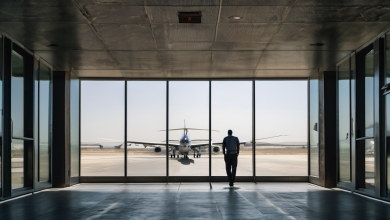 AI-generated image: The image shows a man in a dark-colored shirt and pants standing in a modern airport terminal.