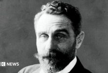 An archive image of Roger Casement in Black and white. He has a thick beard and moustache, and short wavy hair.