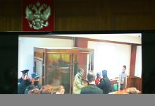 A screen set up at a hall of the Moscow City Court broadcasts the verdict in the trial of U.S. citizen Stephen Hubbard, accused…
