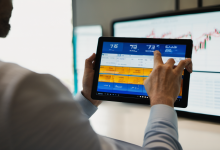 AI-generated image: A man is holding a tablet in his hands, using it to view a screen.