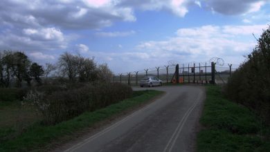 RAF Fairford airbase in the Cotswolds, England, with military aircraft visible in the background