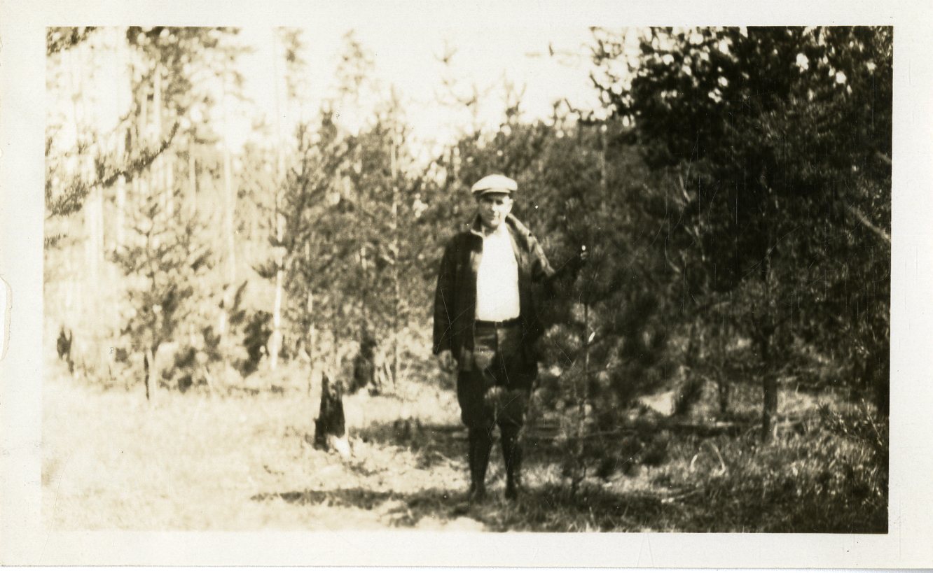 Man in Stand of Norway Pine - DPLA - 4d39a2d485947e9593cc3d60944724da.jpg