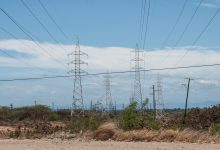 Electricity transmission pylons crossing arid scrub in Margarita Island, Venezuela.jpg