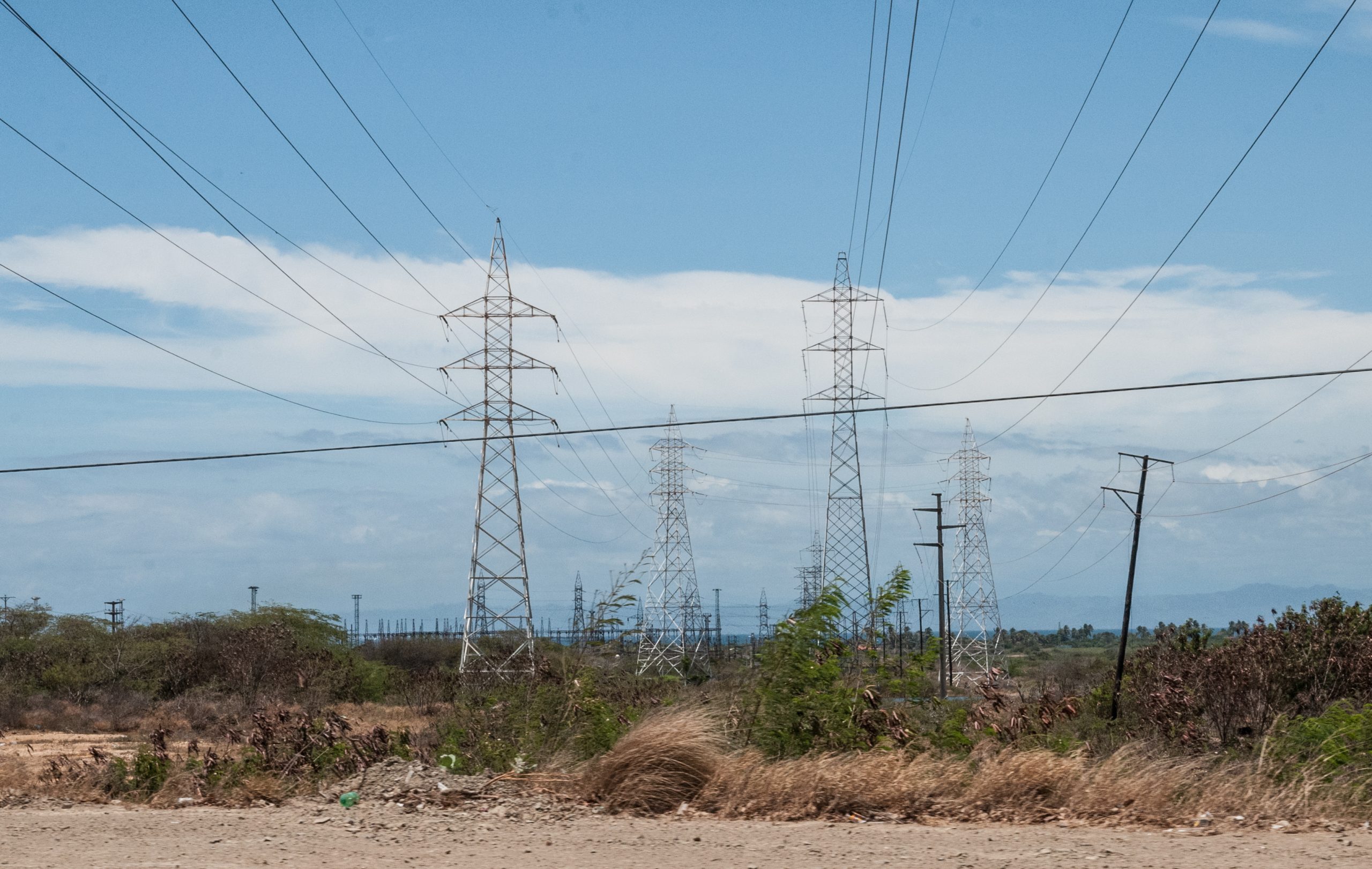 Electricity transmission pylons crossing arid scrub in Margarita Island, Venezuela.jpg